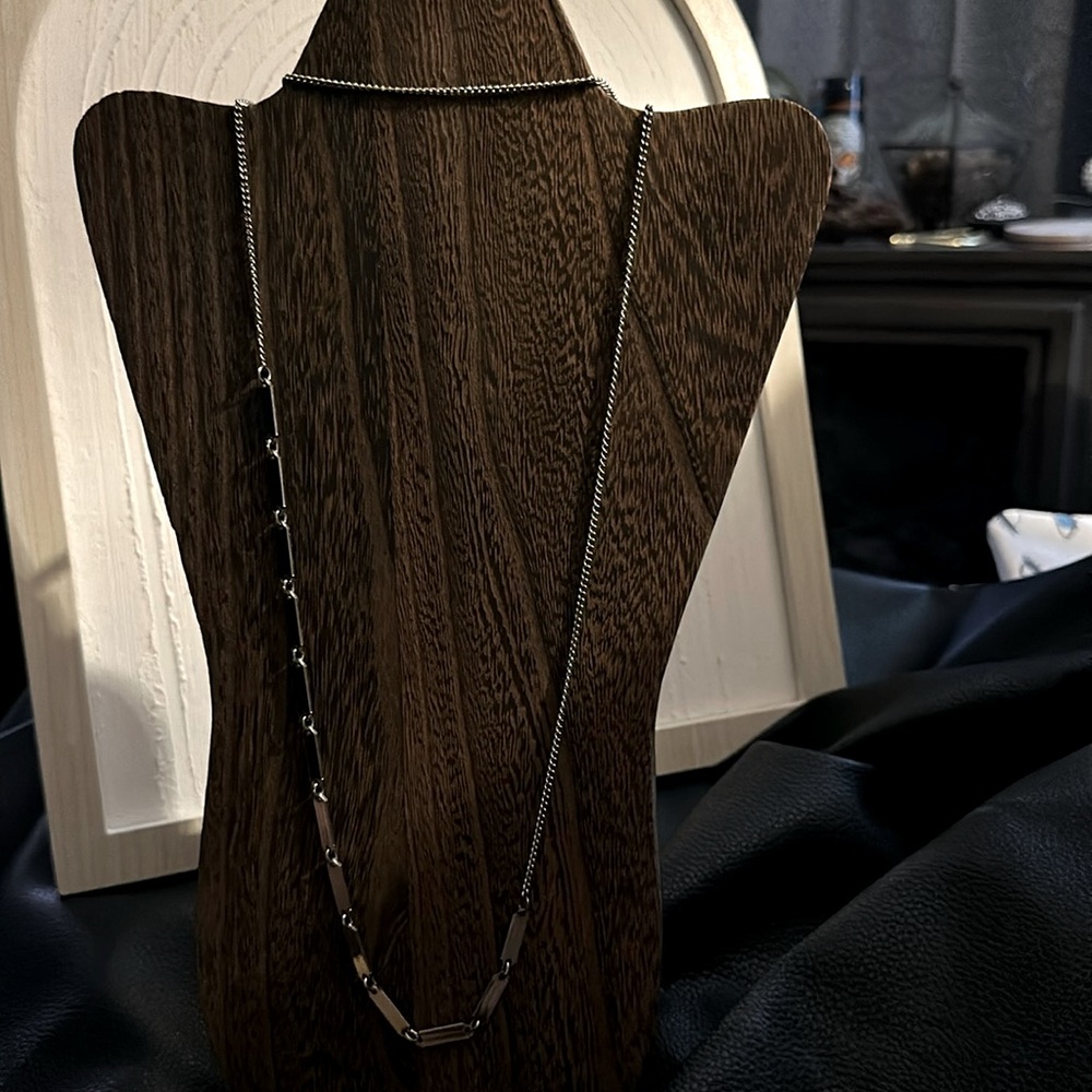 Vintage 48inch long silver tone necklace.  11inches of mini silver detail tabs.